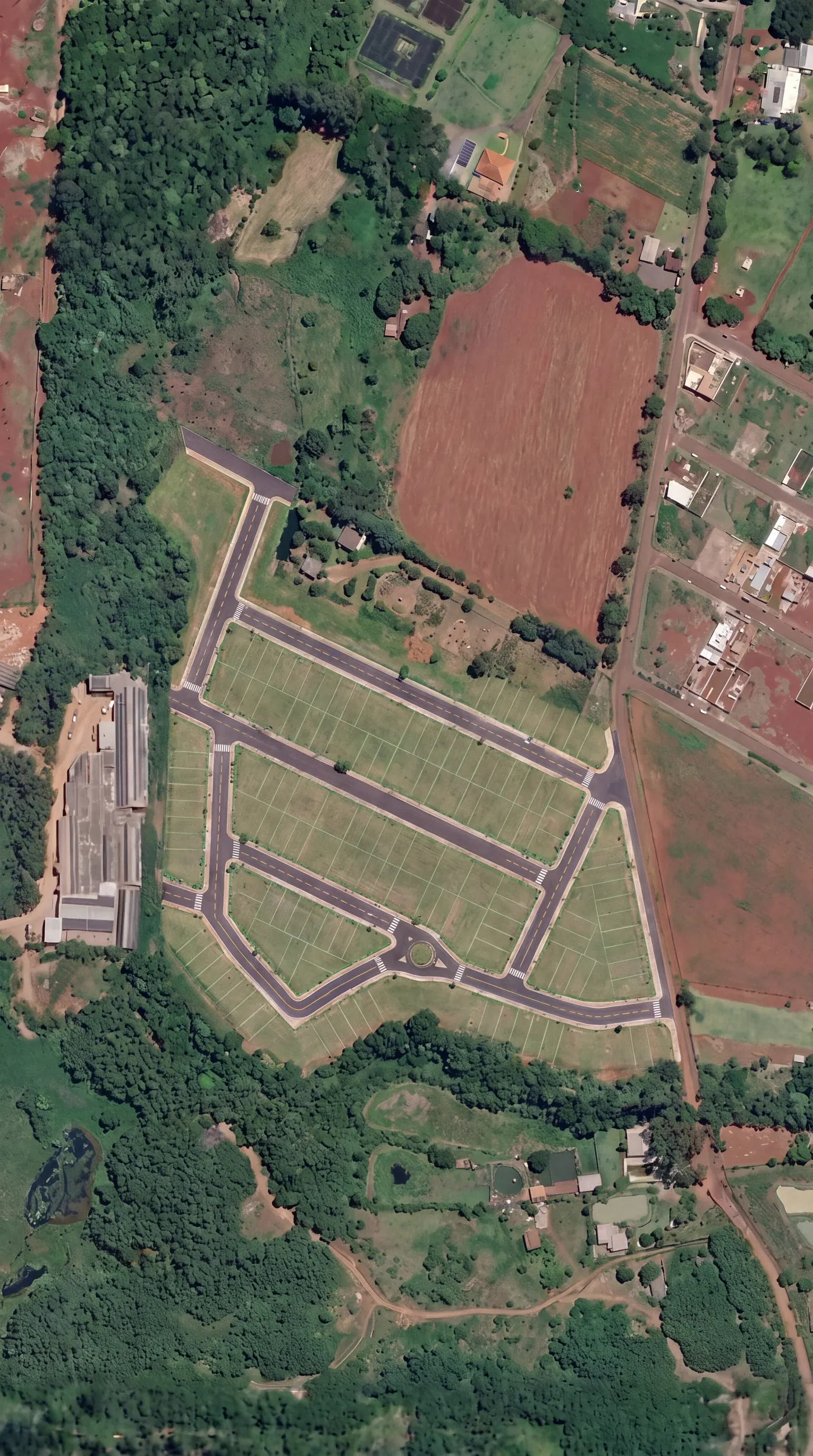 Vista de cima ilustrativa do Jardim Isabel concluído, com ruas asfaltadas e lotes demarcados